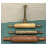 Three wooden rolling pins and masher