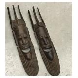 Pair of carved wood tribal face wall art