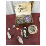 Fishing lures, weights, and line in cigar box