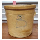 Crock with blue squiggle some damage