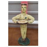 Cast iron Coca-Cola man holding tray