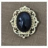 Brooch w/ black stone, tested 10k gold