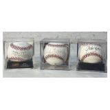 3 Autographed Official Major League Basbealls.