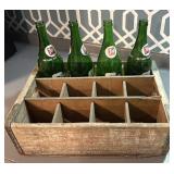 Vintage 7-Up bottles and wooden case.