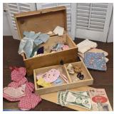 Nice pine trunk with doll clothing and