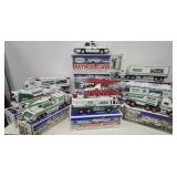 12 Hess trucks in orig boxes