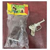 Vintage training boxing gloves and G-Man cap gun