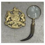 Brass King Arms trivet, magnifying glass