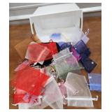 Small tub of empty jewelry bags