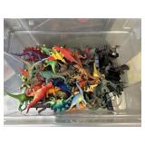 Toy dinosaurs with small tub.