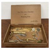 Box of tie clips and cufflings