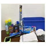 Tote of cleaning supplies, washcloths, and