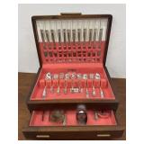 Crown flatware in wooden chest