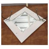 Beveled mirror with hooks