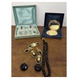 Estes Lauder shell compact mirror, necklace, and