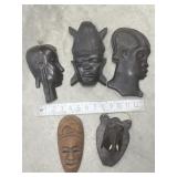 Carved wood silhouettes, mask, elephant, etc.