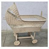 Early wicker bassinet wooden wheels (display only)