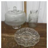 Glass cake plate, pitcher, egg plate