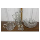 Heavy cut glass pitcher, bowl, salt & pepper etc