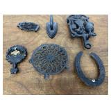 Cast iron - trivets, candle holder, sad iron
