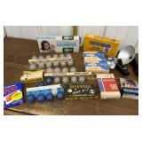 Vintage camera flash bulbs, flash holders, film