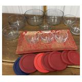 Glass storage bowls, lids, red plate