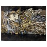 Costume jewelry pins, necklaces, show clips etc