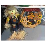 Fall decorations, scarecrow, and welcome wooden