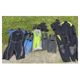 3 Wetsuits And 3 Swimming Fins