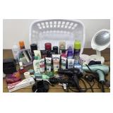 Laundry basket full of hair dryers, curling iron,