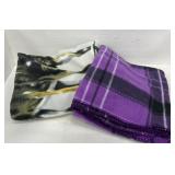 2 Fleece throw blankets. One well loved see pictur