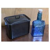 Black enamelware pan & blue bottle