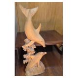 Wooden carved dolphins sculpture