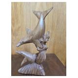 Wooden carved dolphin sculpture