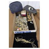 Assorted costume jewelry, tokens, keychains etc