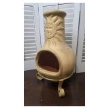 Clay terracotta chiminea on iron base