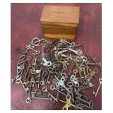 Wooden box full of keys