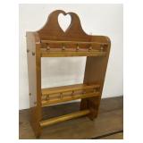 Small hanging wooden shelf with towel holder