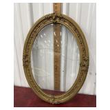 Gold guilded ornate oval frame with dome glass