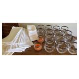 Pretty rock tumblers w/silver trim, linens. 16