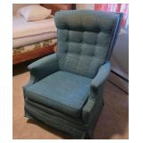 Grandma's teal blue tufted wingback swivel rocker