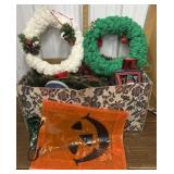 Box full of mostly Christmas decor. Lantern may