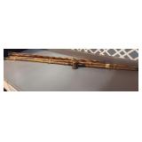 Old vintage bamboo fishing-poles one reel