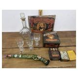 Jack Danielï¿½s tins, decanter and glasses, playing
