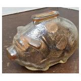 Small carnival glass piggy bank full of pennies