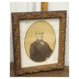 Ornate carved wood frame / photograph of man
