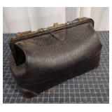 Q2 ï¿½Guaranteed Leatherï¿½ stamped Suitcase