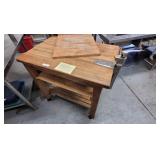 A Rolling Chopping block ta with commercial can op