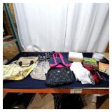 Assorted mixed lot featuring a variety of bags, t-