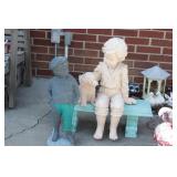 Boy w/ dog on bench, & golf caddy